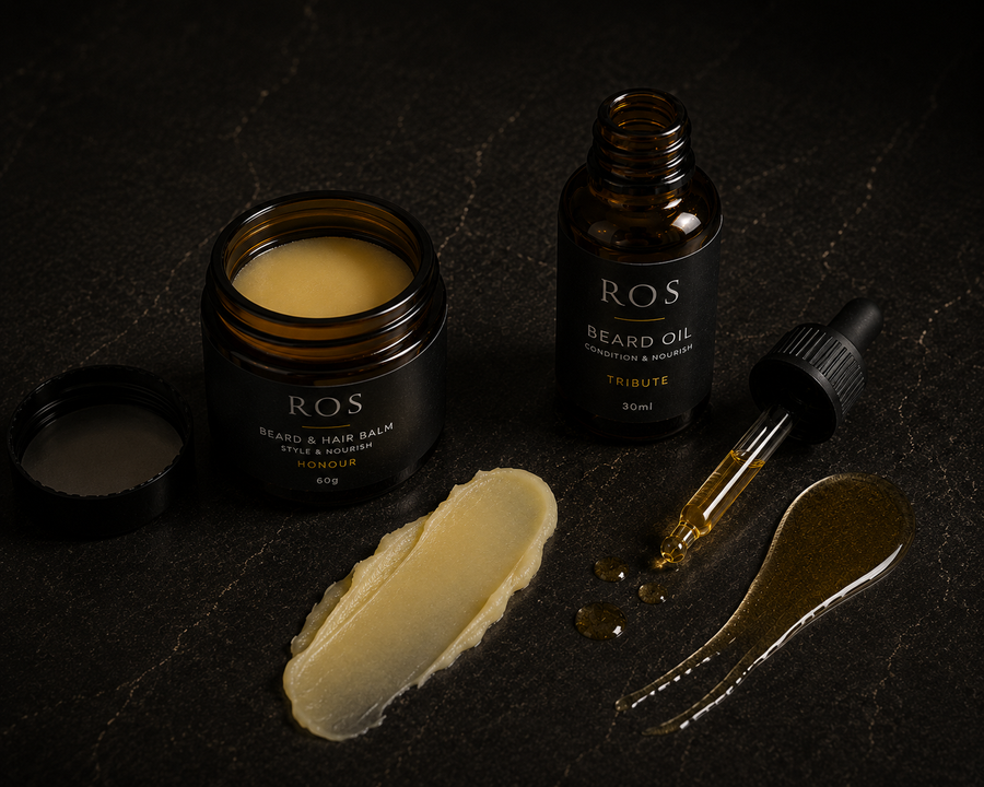 ROS Beard & Hair Balm and ROS Beard Oil set on a dark textured background, featuring an open balm jar, a bottle, a dropper, and two dollops of the products.