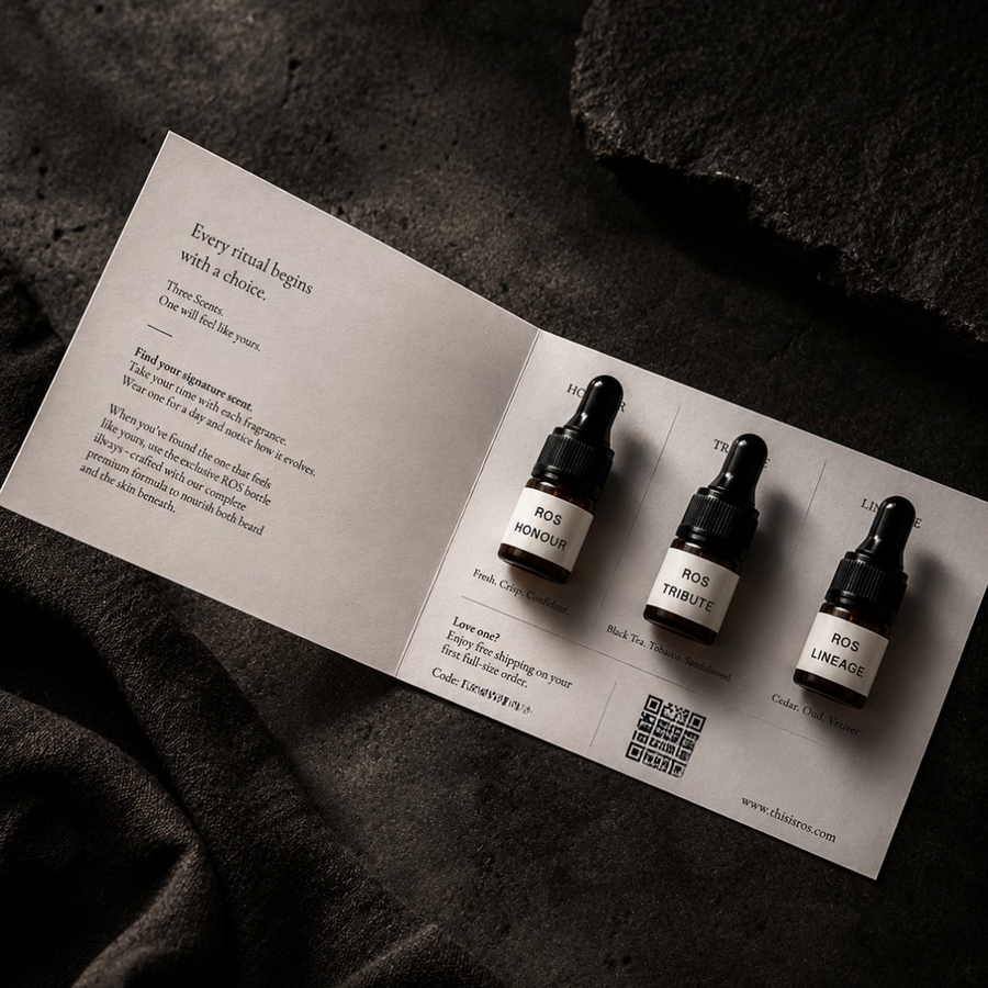 Three ROS beard oil scent sample dropper bottles on a leaflet with text on a dark textured background